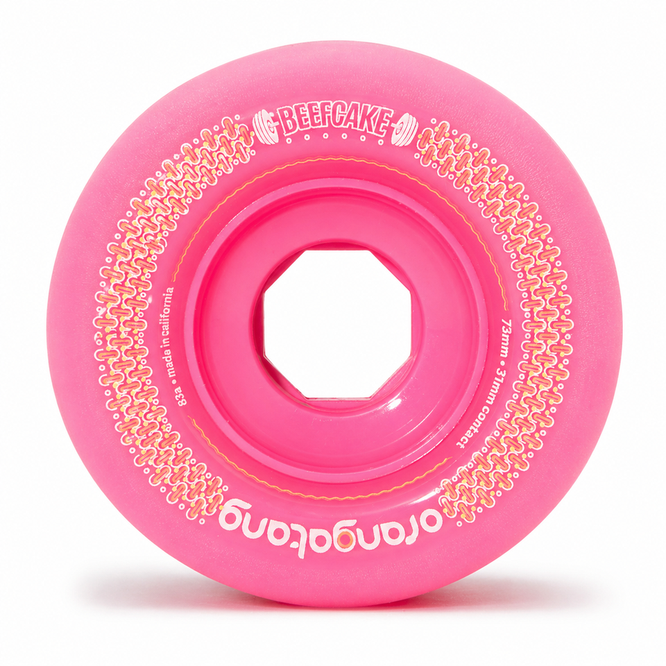 Orangatang 73mm Beefcake (83a, pink) longboard skateboard wheel (front)